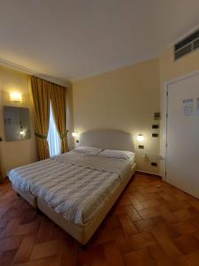 Posteľ alebo postele v izbe v ubytovaní Hotel Borgovico