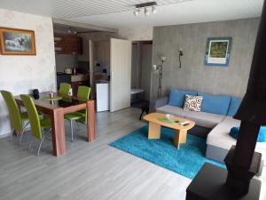 a living room with a couch and a table at SRB Sadovo-Resort-Bulgaria in Sadovo
