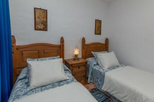Voodi või voodid majutusasutuse Casa Cucú toas