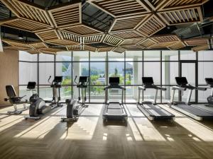 a gym with a lot of exercise equipment in a room at InterContinental Phuket Resort by IHG in Kamala Beach