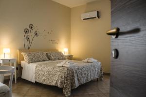 Кровать или кровати в номере Dimora Di Campagna