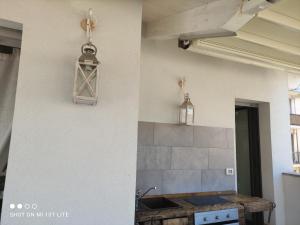 A kitchen or kitchenette at Appartamento Spotorno con ampio terrazzo attrezzato anche con angolo cottura