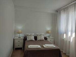 Posteľ alebo postele v izbe v ubytovaní b Apartamentos Diego
