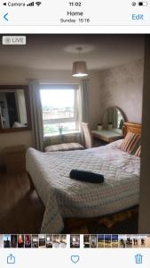 a picture of a bedroom with a bed and a window at Skyline views in Glasgow