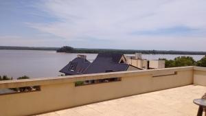 a view from the balcony of a house on the water at 11 Peyret Rent Aparts in Colón
