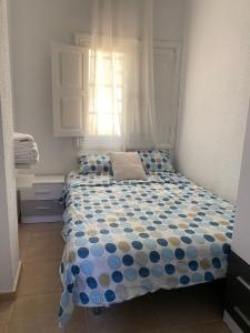 Säng eller sängar i ett rum på Apartamento vacacional