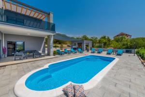 a swimming pool in the backyard of a house at Luxury Villa Bava-5minutes to center in Zvekovica