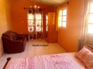 Postel nebo postele na pokoji v ubytování TULEAR APPARTEMENTS CHAMBRES Rez de chaussée et Etage