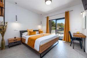 a bedroom with a bed and a table and a window at Luxury Villa Bava-5minutes to center in Zvekovica +43 photos