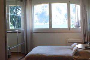 A bed or beds in a room at Apartments Gelsomino, Orchidea and Magnolia