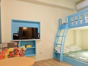 Letto o letti in una camera di 墾丁舍廷親子會館 KT13 Hotel