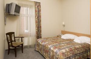 Кровать или кровати в номере TOSS Hotel