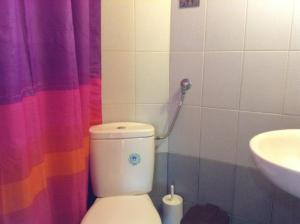 a bathroom with a toilet and a sink at Studios LaLu in Skiathos Town