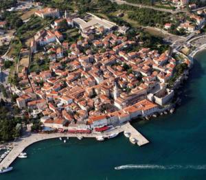 an aerial view of a city with a harbor at Rooms Amfora in Krk +8 photos