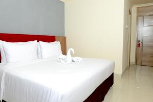 Kama o mga kama sa kuwarto sa Moritz Hotel RSAB Harapan Kita