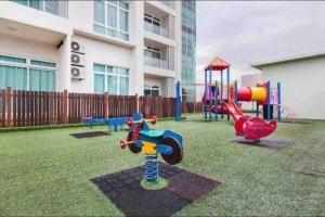 a playground in a yard in front of a building at KSL City Mall 6-8pax（K26）Netflix｜Smart TV 55inch in Johor Bahru