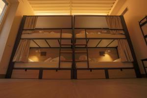 a room with four bunk beds in it at Hostel Nut in Granada