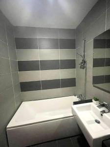 a bathroom with a white tub and a sink at KSL City Mall 6-8pax（K26）Netflix｜Smart TV 55inch in Johor Bahru