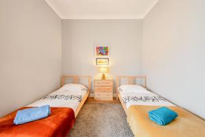 Ein Bett oder Betten in einem Zimmer der Unterkunft La Petit Maison