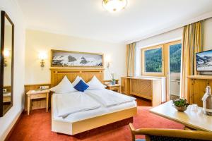 Posteľ alebo postele v izbe v ubytovaní Hotel Das Kohlmais