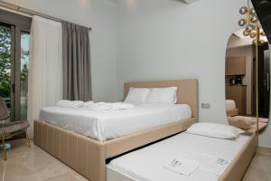 Posteľ alebo postele v izbe v ubytovaní B&D Luxury Suites