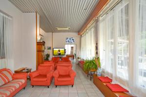 TV a/nebo společenská místnost v ubytování Hotel Villa Colombo