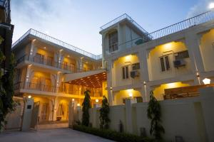 a large white building with its lights on at Maharishi Ayurveda-Boutique Wellness Retreat in Rishīkesh