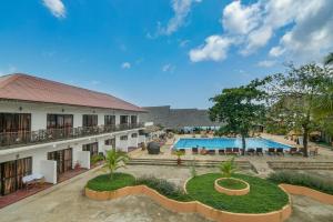 an image of a resort with a swimming pool at Amaan Beach Bungalows in Nungwi