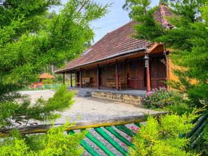 a house with a green fence in front of it at NATURE CASTLE -Traditional villa,Vattavada in Kottakamboor