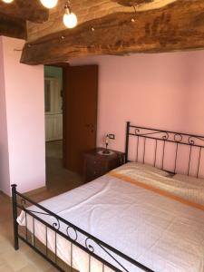 Ένα ή περισσότερα κρεβάτια σε δωμάτιο στο Casa vacanze Pozzo della Polenta