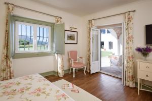 Кровать или кровати в номере Hotel Casa Palmela - Small Luxury Hotels of The World, Hotel & Villas