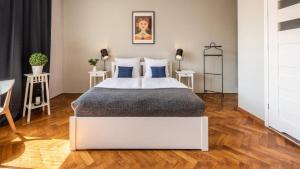 Posteľ alebo postele v izbe v ubytovaní Sereno Apartments