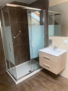 a bathroom with a shower and a sink at Pilgrim’s House in O Pedrouzo +31 photos