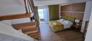 Postel nebo postele na pokoji v ubytování Stefania Apartments