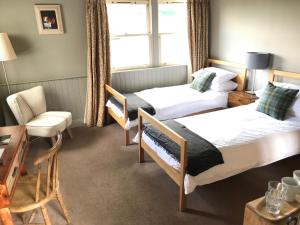 Letto o letti in una camera di The Cross Keys in Kippen