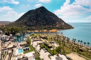an aerial view of a resort with a mountain at Radisson Collection Hotel, Bodrum in Akyarlar