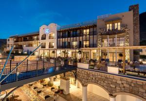 an exterior view of a hotel at night at Radisson Collection Hotel, Bodrum in Akyarlar