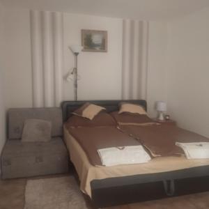 Postel nebo postele na pokoji v ubytování Tímea Vendégház