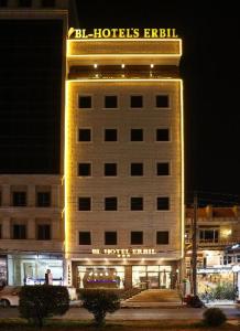 a hotel building with a sign on top of it at BL Hotel's Erbil in Erbil