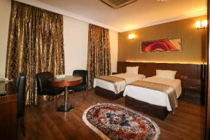 Ένα ή περισσότερα κρεβάτια σε δωμάτιο στο BL Hotel's Erbil