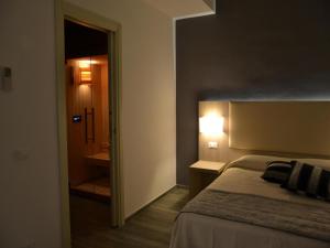 Posteľ alebo postele v izbe v ubytovaní Palazzo Ducale Suites