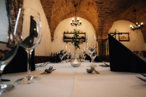 a table with wine glasses on top of it at Landgasthof Zum Stern Wasserkuppe Rhön in Poppenhausen