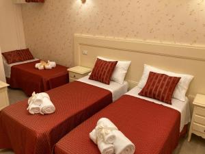 A bed or beds in a room at B&B Orchidea