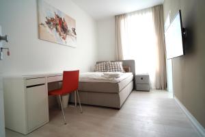 TV a/nebo společenská místnost v ubytování Hotel Böke Rheinfelden