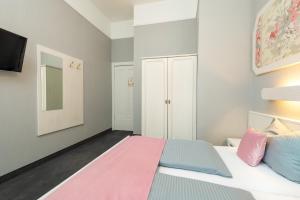 Postel nebo postele na pokoji v ubytování W22 Hotel am Kurfürstendamm
