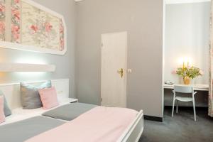 Postel nebo postele na pokoji v ubytování W22 Hotel am Kurfürstendamm