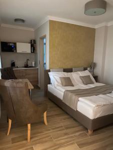 Posteľ alebo postele v izbe v ubytovaní Zalakarosi Zóra Apartmanház