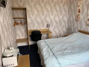 Postel nebo postele na pokoji v ubytování Grant Arms Hotel
