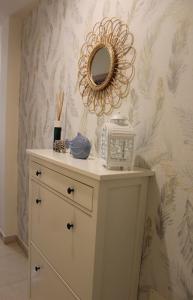 a dressing table with a mirror on a wall at Apartamento Ro-Ro Valle Gran Rey in Valle Gran Rey