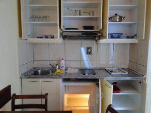 a small kitchen with a sink and a counter at Blue Palace Guest House in Budva +31 photos